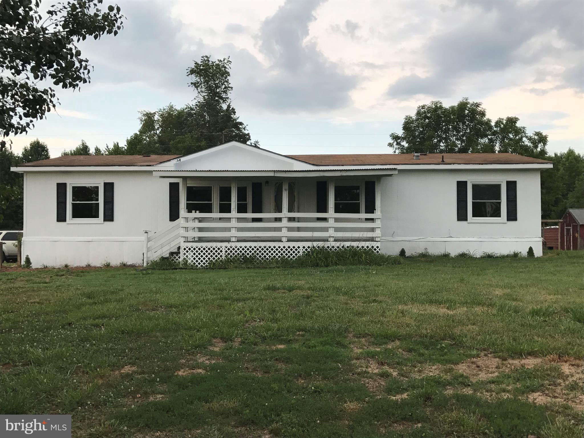 11641 Belfonte Road Bumpass, VA 23024 - Photo 1 of 23 a front view of a house with a garden