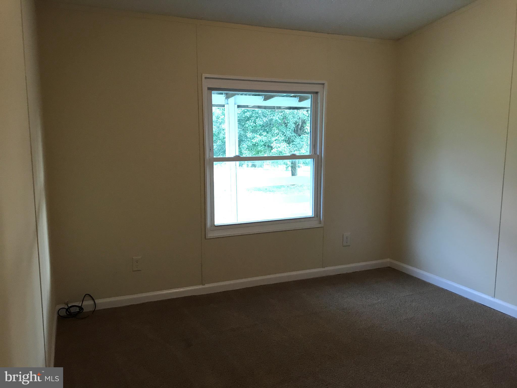 11641 Belfonte Road Bumpass, VA 23024 - Photo 12 of 23 an empty room with a window