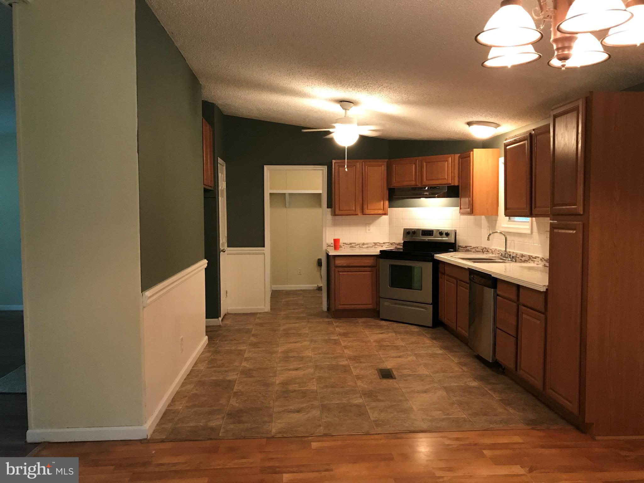 11641 Belfonte Road Bumpass, VA 23024 - Photo 14 of 23 a kitchen with stainless steel appliances granite countertop a sink counter space and cabinets