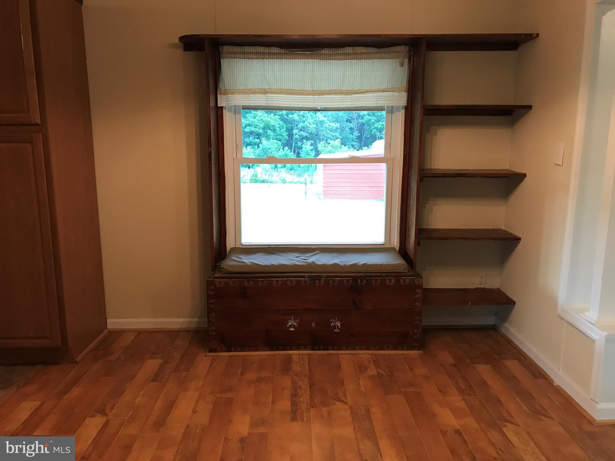 11641 Belfonte Road Bumpass, VA 23024 - Photo 16 of 23 a living room with a bed and a window