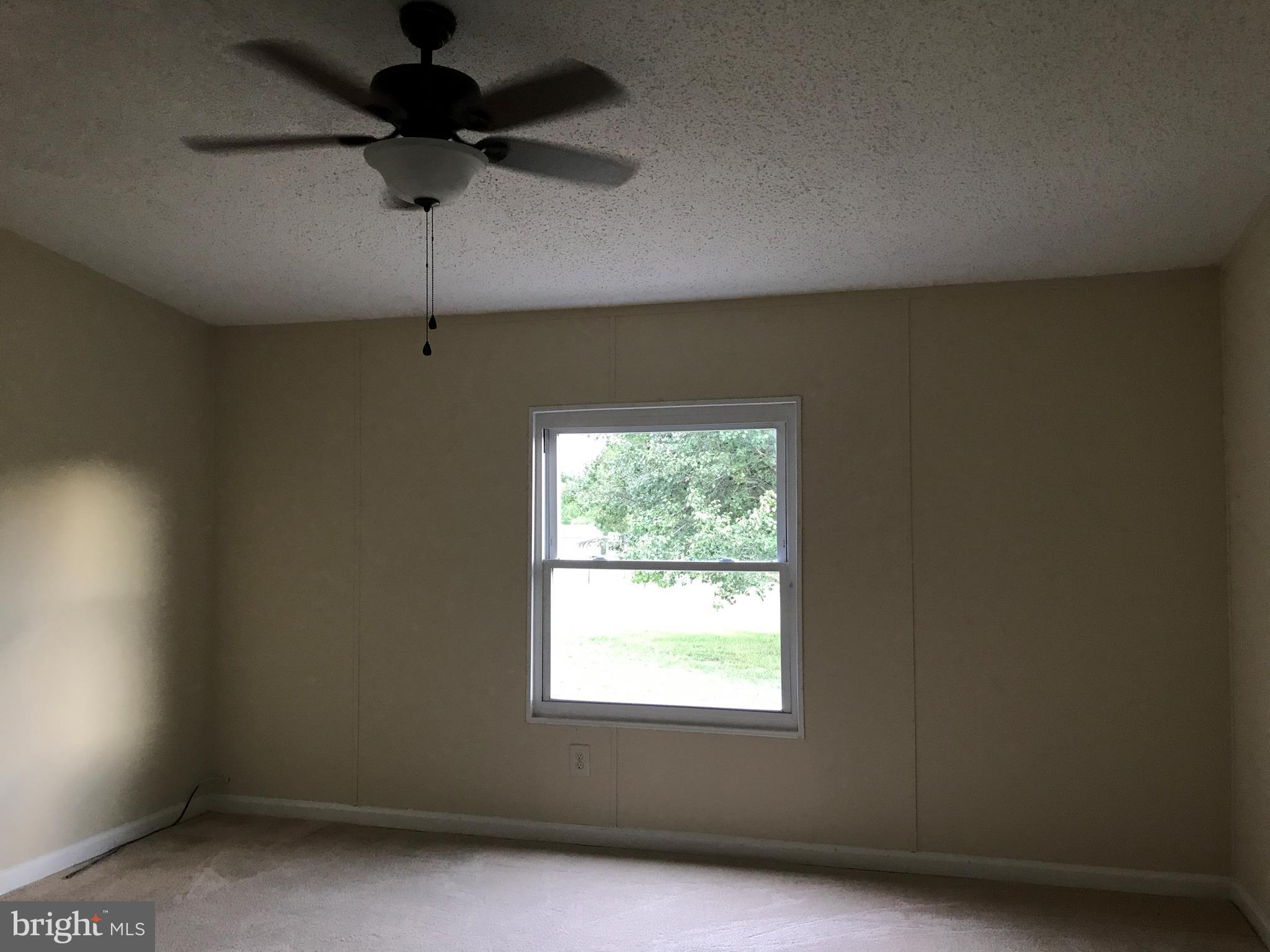 11641 Belfonte Road Bumpass, VA 23024 - Photo 20 of 23 an empty room with a window