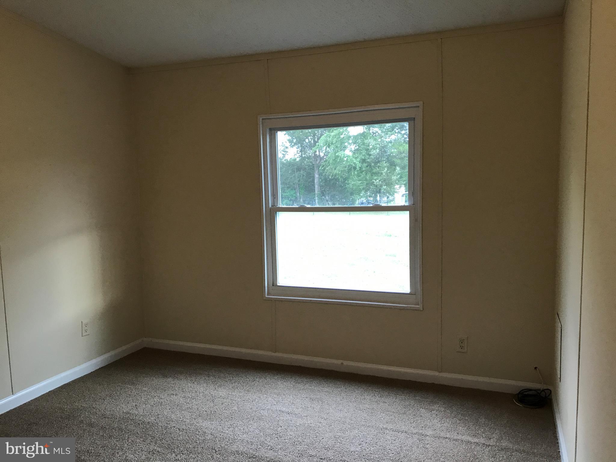 11641 Belfonte Road Bumpass, VA 23024 - Photo 10 of 23 an empty room with a window