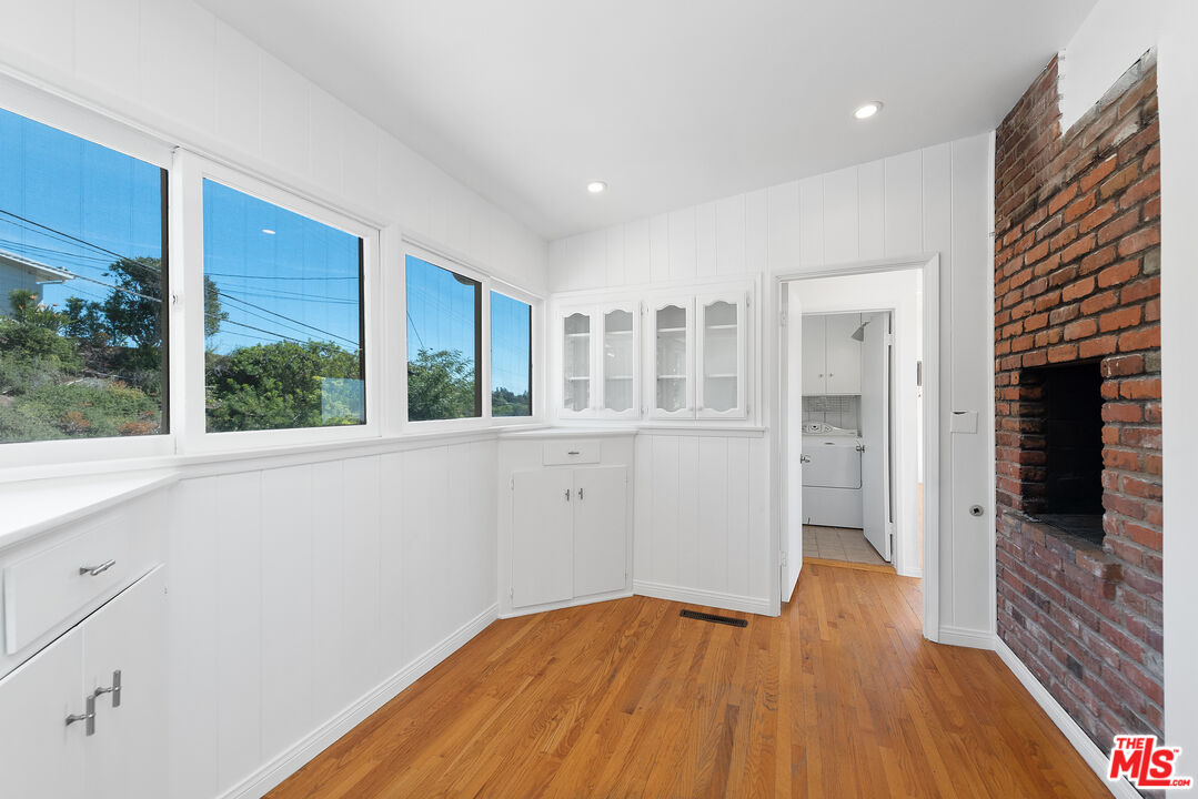 1211 North Kenter Avenue Los Angeles, CA 90049 - Photo 4 of 11 a view of empty room with wooden floor and fan