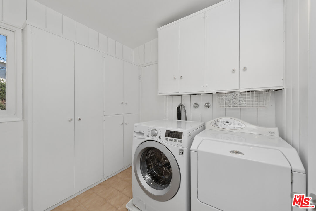 1211 North Kenter Avenue Los Angeles, CA 90049 - Photo 9 of 11 a utility room with dryer and washer