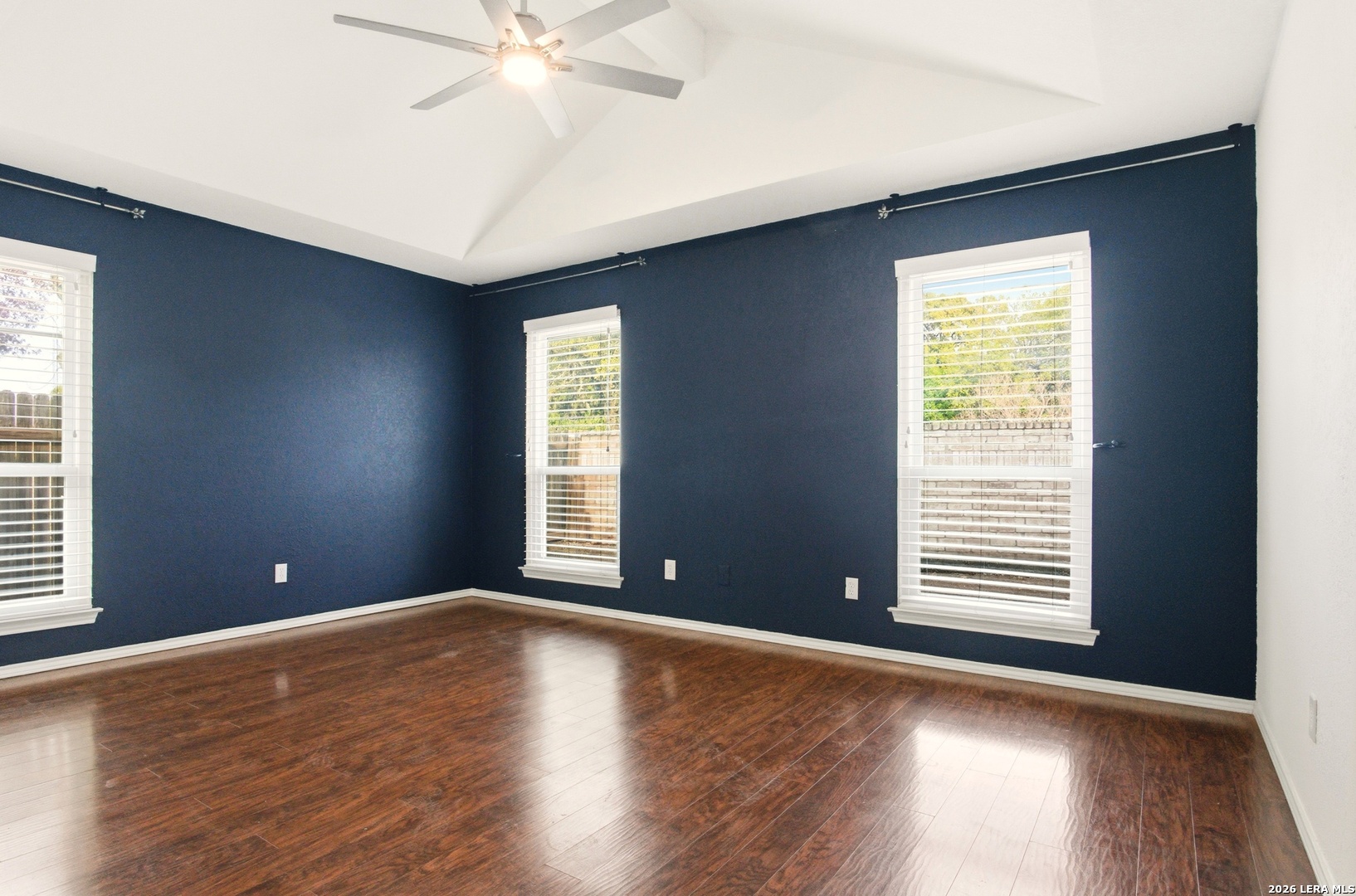 2434 Canyon Rim San Antonio, TX 78232 - Photo 13 of 28 a view of an empty room with wooden floor and a window