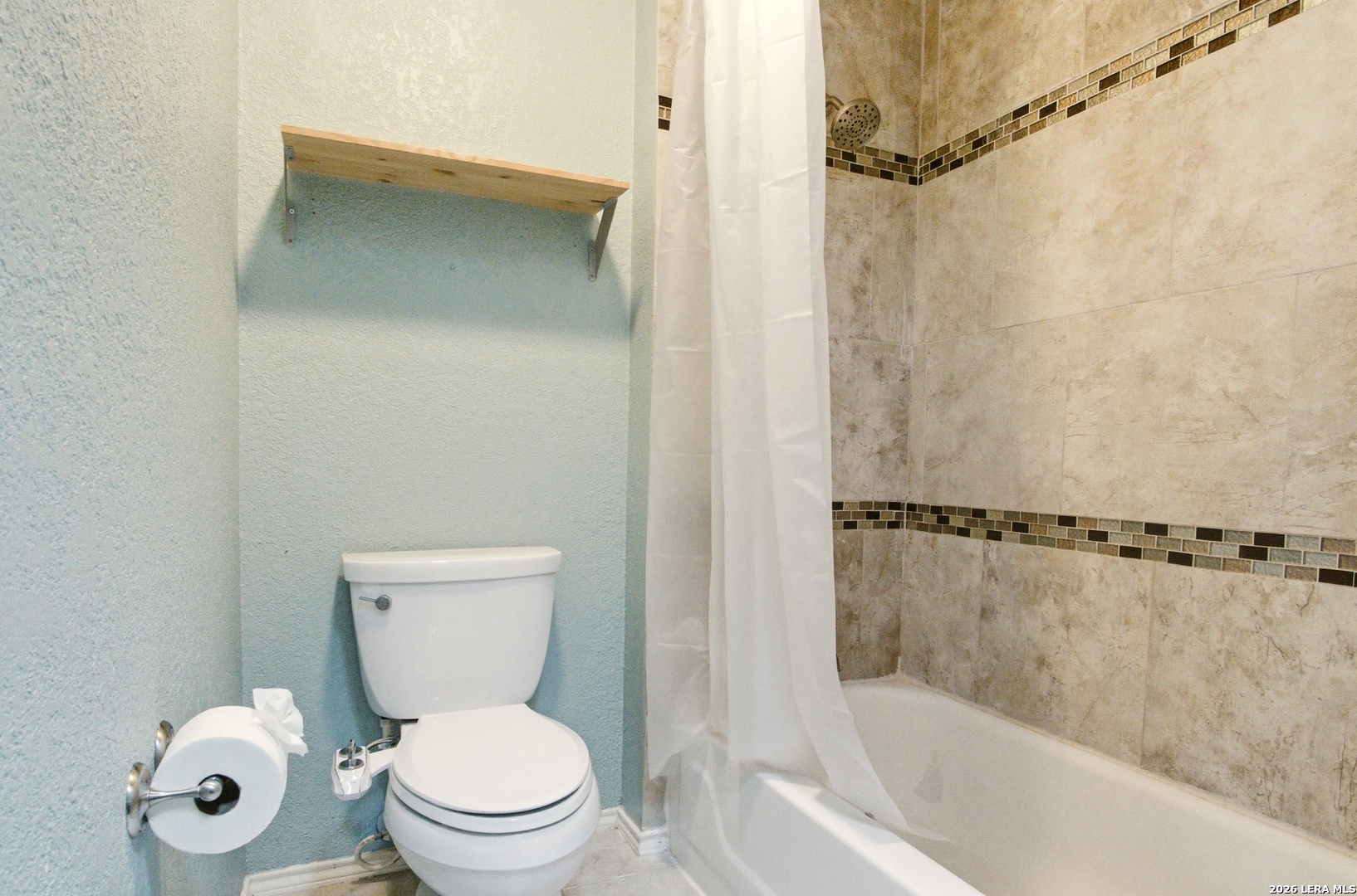 2434 Canyon Rim San Antonio, TX 78232 - Photo 16 of 28 a white toilet sitting next to a bathtub