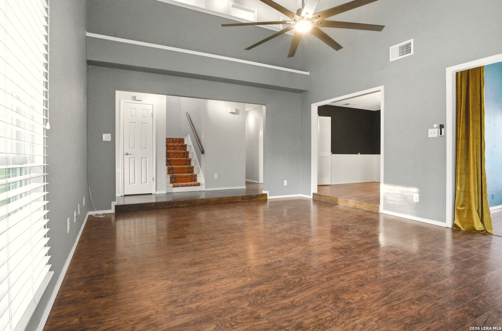 2434 Canyon Rim San Antonio, TX 78232 - Photo 4 of 28 wooden floor in an empty room with a window