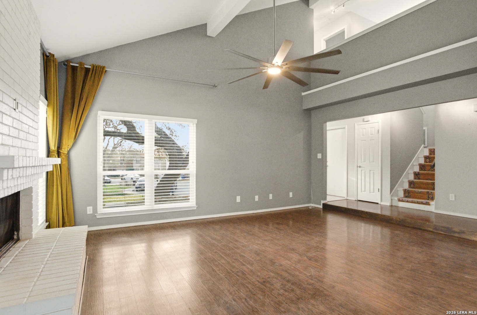 2434 Canyon Rim San Antonio, TX 78232 - Photo 5 of 28 an empty room with wooden floor and windows
