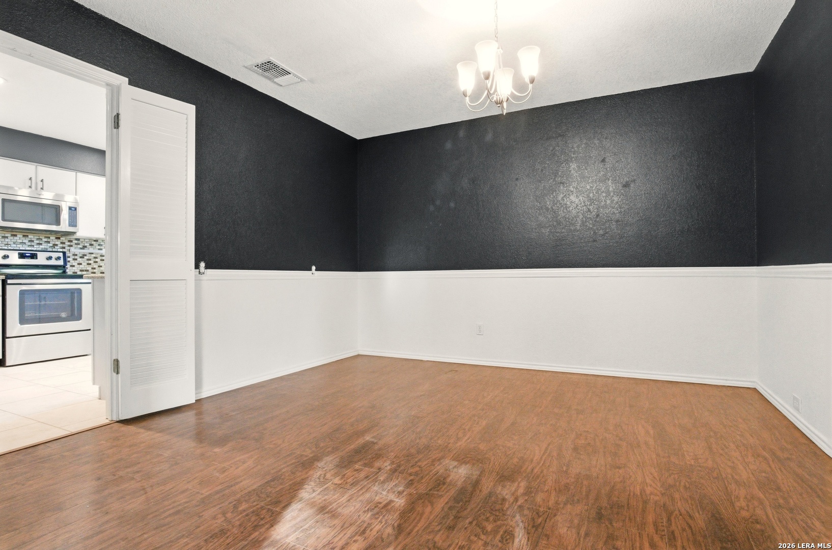 2434 Canyon Rim San Antonio, TX 78232 - Photo 8 of 28 a living room with a wooden floor