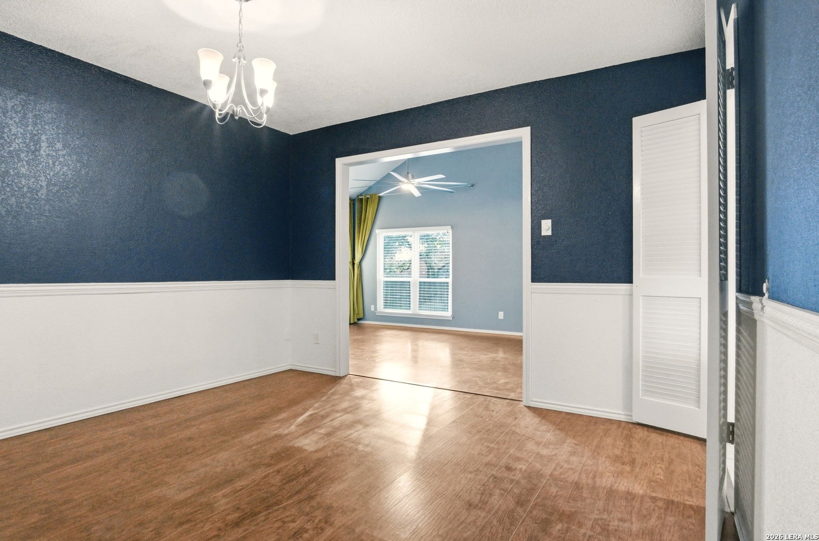 2434 Canyon Rim San Antonio, TX 78232 - Photo 9 of 28 a view of an empty room with wooden floor and a window