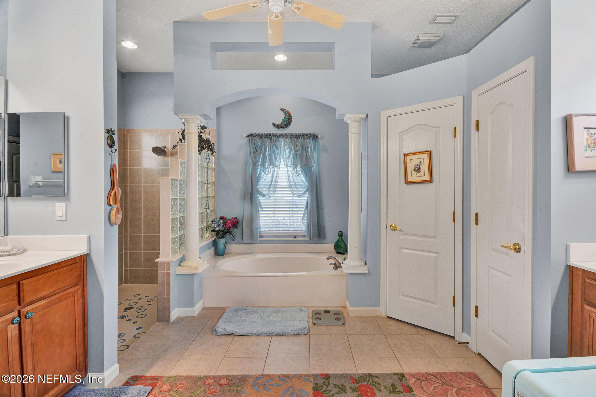 5950 West Shores Road Orange Park, FL 32003 - Photo 7 of 42 a bathroom with a sink a toilet and shower