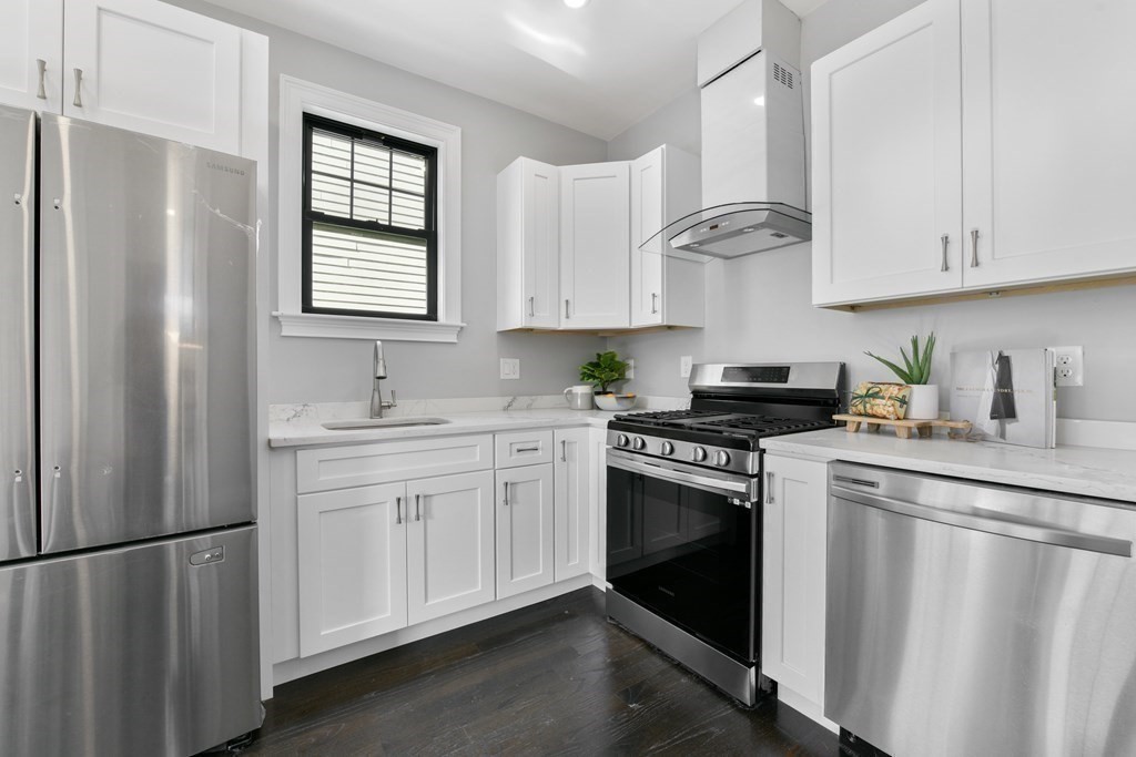 18 Albion Street, Unit 2 Boston, MA 02119 - Photo 1 of 22 a kitchen with white cabinets and white appliances