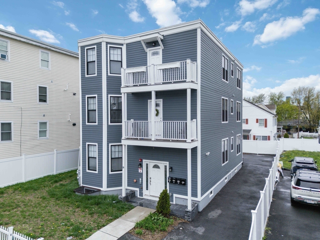 18 Albion Street, Unit 2 Boston, MA 02119 - Photo 14 of 22 a front view of a house with parking space