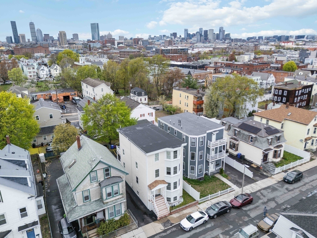 18 Albion Street, Unit 2 Boston, MA 02119 - Photo 17 of 22 an aerial view of a house with a lake view