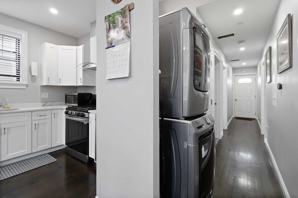 18 Albion Street, Unit 2 Boston, MA 02119 - Photo 5 of 22 a kitchen with stainless steel appliances a refrigerator sink and cabinets
