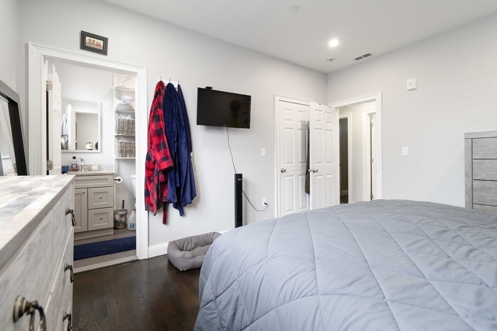 18 Albion Street, Unit 2 Boston, MA 02119 - Photo 8 of 22 a view of walk in closet with clothes and shoes