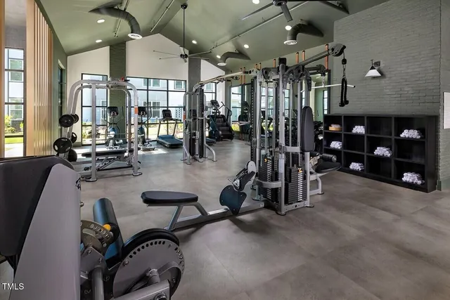 a room with gym equipment and a large window