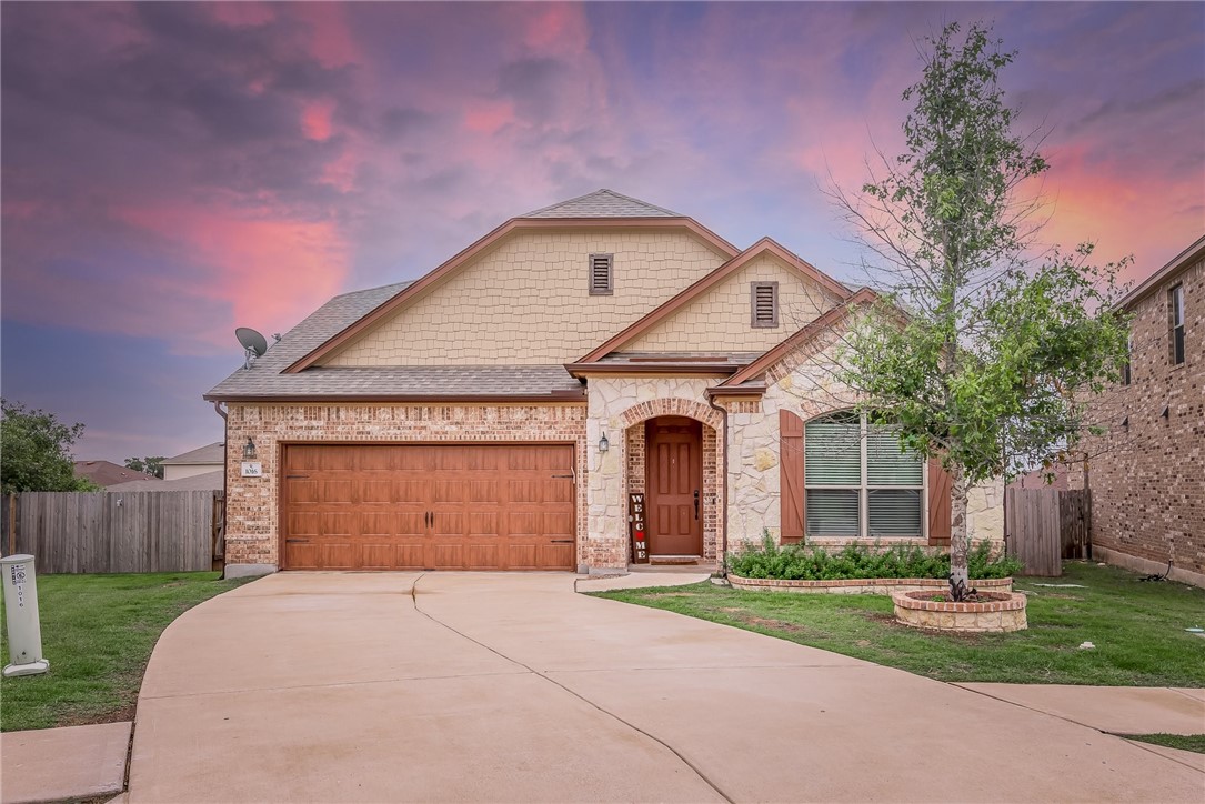 1016 Rio Azul Cove Leander, TX 78641 - Photo 1 of 1 a front view of a house with a yard and garage