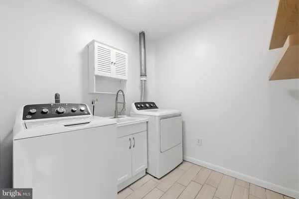 an empty room with a ceiling fan and window
