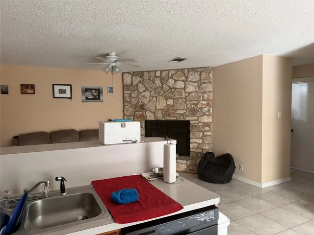 a room with a couch and a fireplace