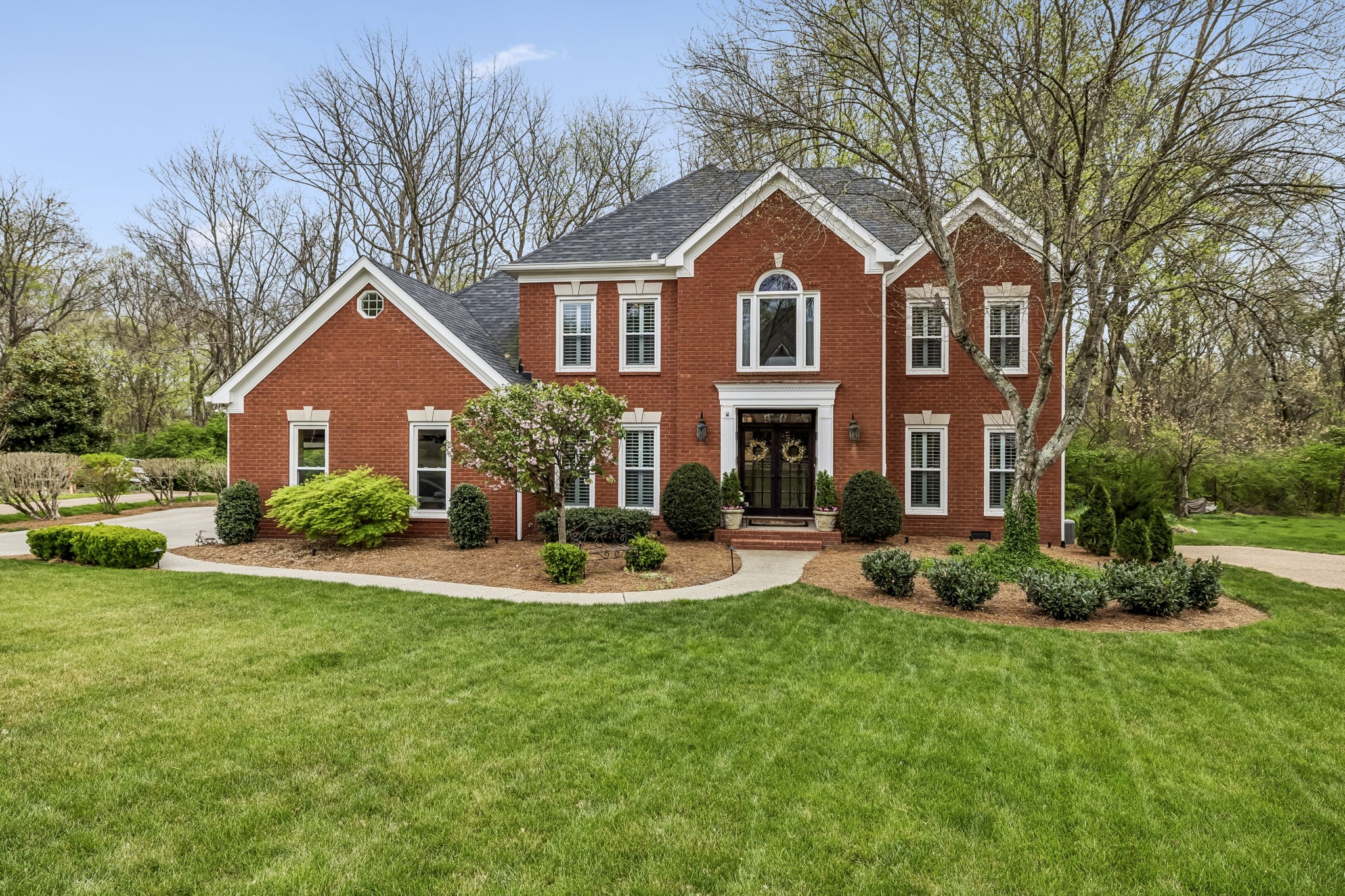 208 Landon Court Franklin, TN 37064 - Photo 1 of 58 a front view of a house with a yard and garage