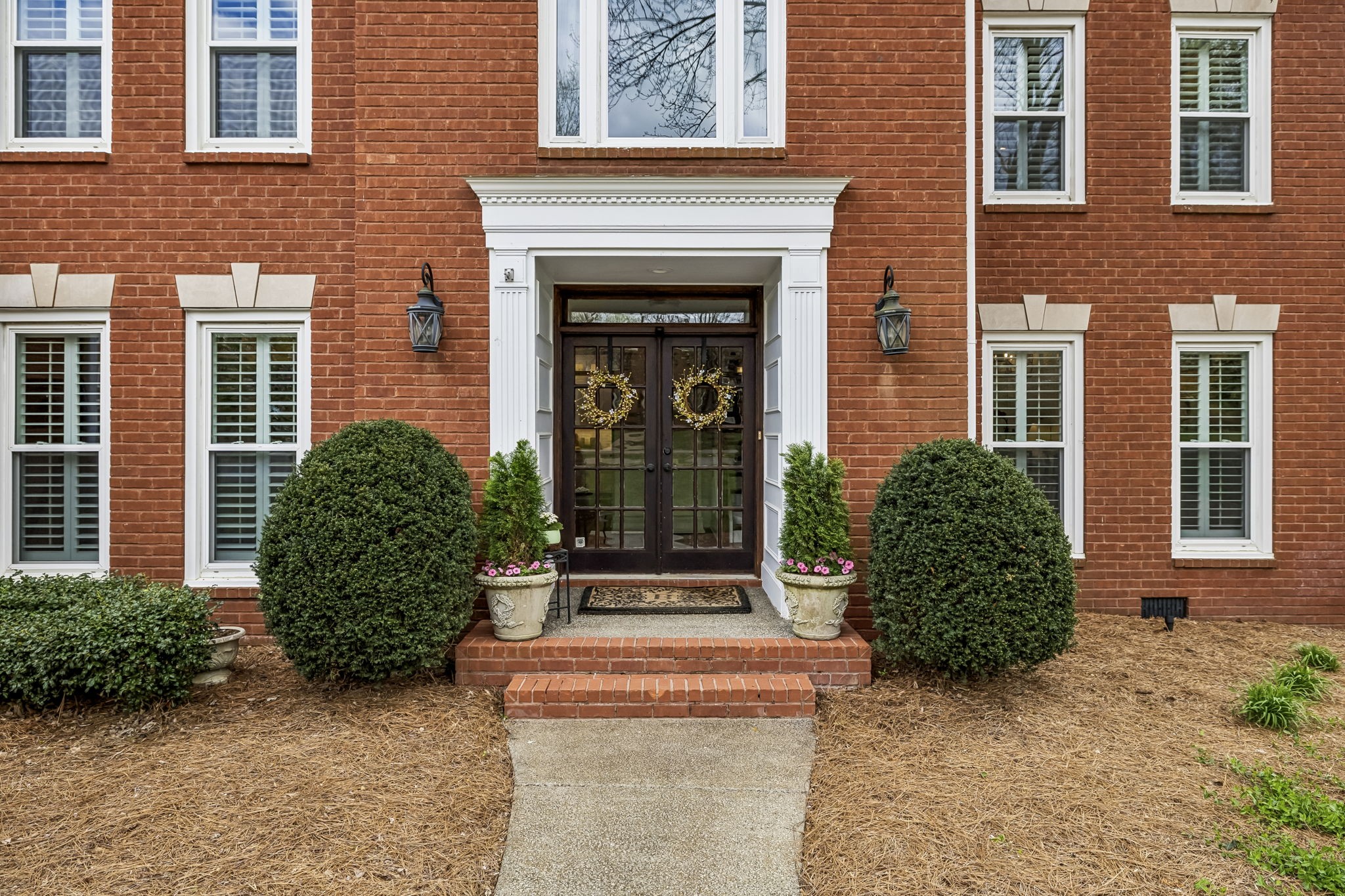 208 Landon Court Franklin, TN 37064 - Photo 2 of 58 a front view of a house with garden