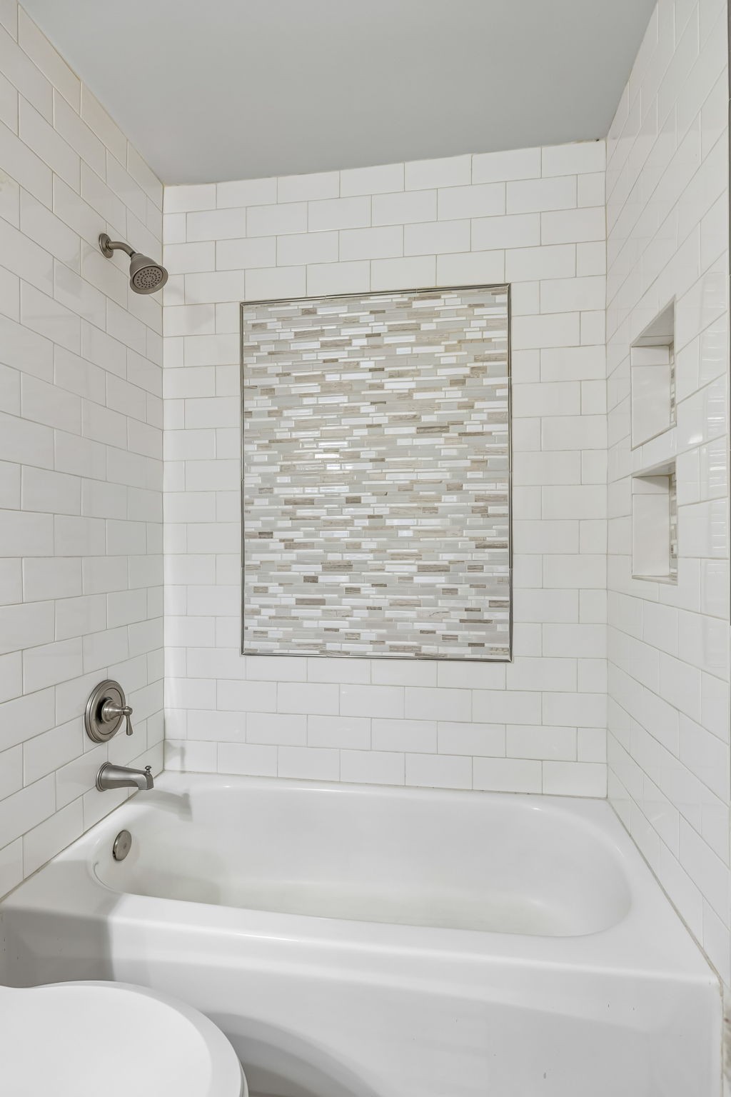 208 Landon Court Franklin, TN 37064 - Photo 30 of 58 a bathroom with a bathtub and a shower