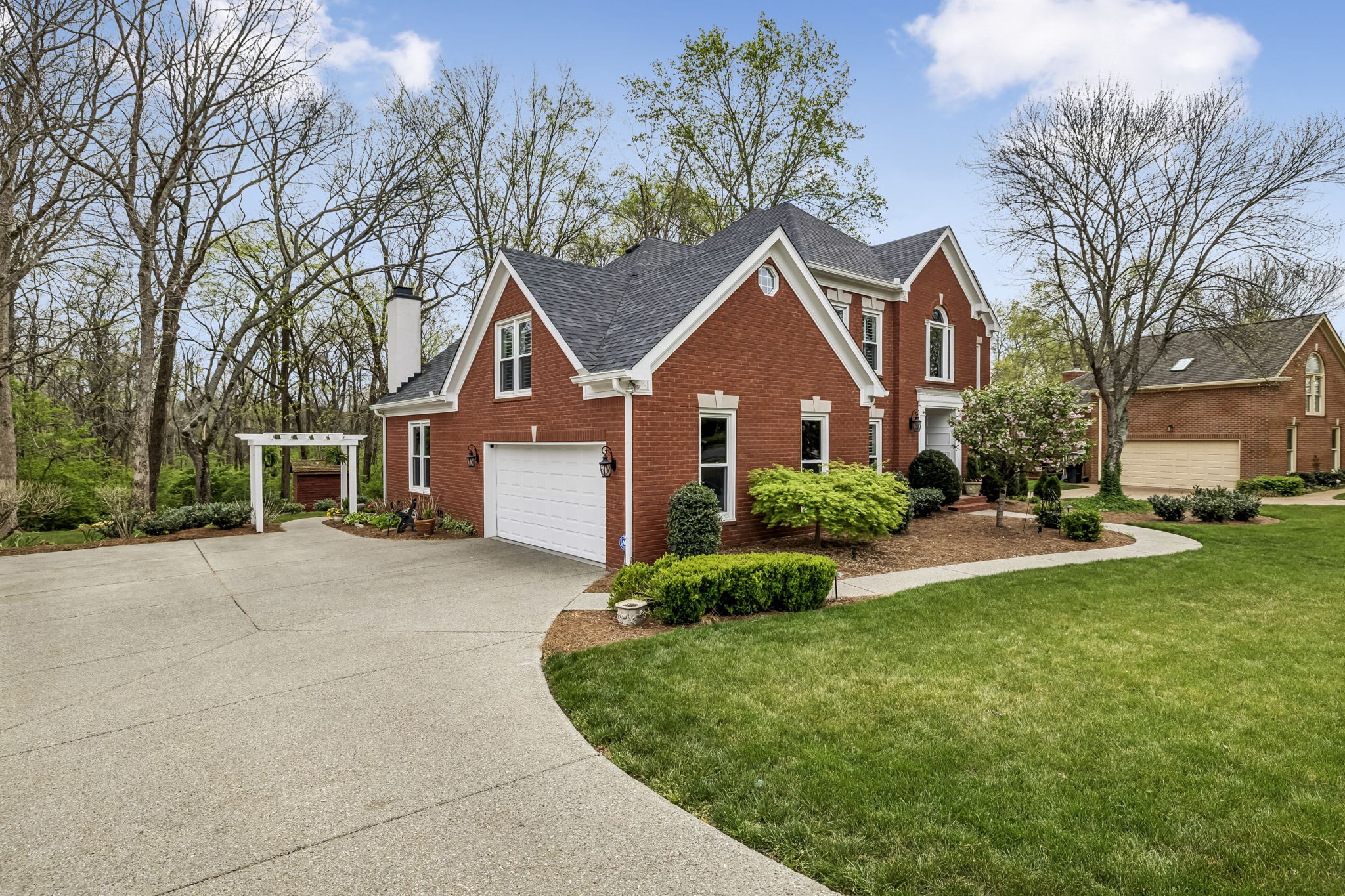 208 Landon Court Franklin, TN 37064 - Photo 3 of 58 a front view of a house with a yard and garage