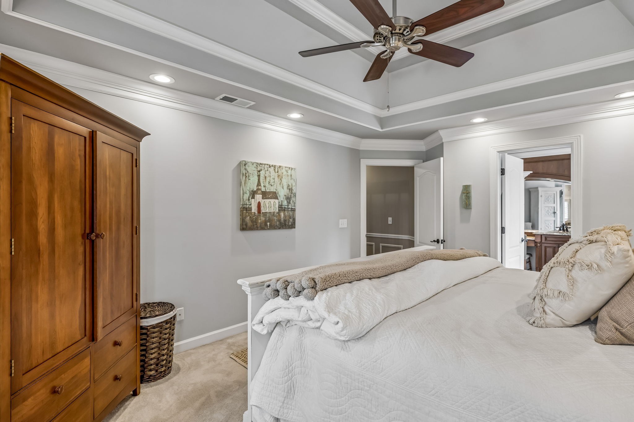 208 Landon Court Franklin, TN 37064 - Photo 33 of 58 a bedroom with a bed and a chandelier