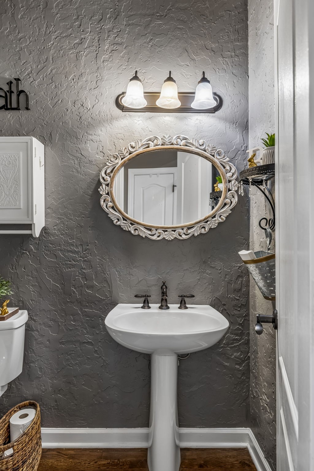 208 Landon Court Franklin, TN 37064 - Photo 37 of 58 a bathroom with a sink a toilet and mirror