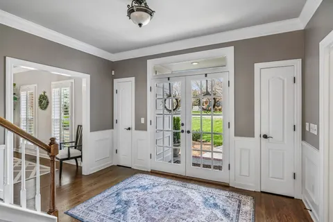 a view of a hallway with dining area