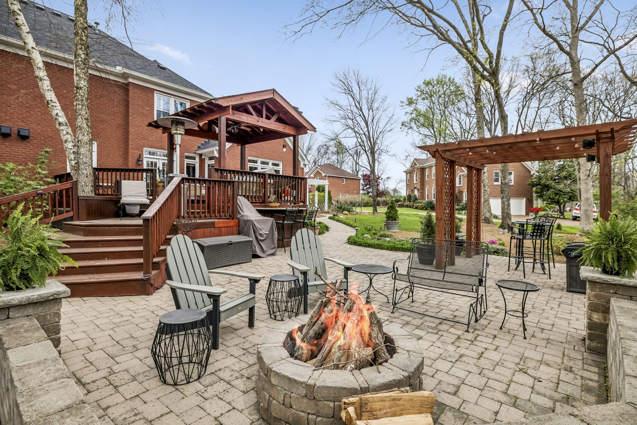 208 Landon Court Franklin, TN 37064 - Photo 45 of 58 a view of a patio with table and chairs potted plants and large tree