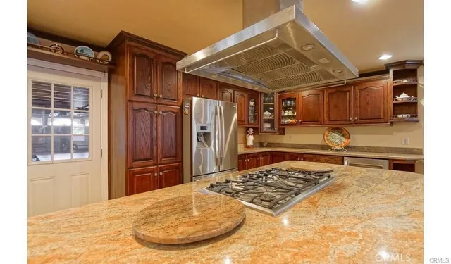 a view of a kitchen counter space and wooden floor