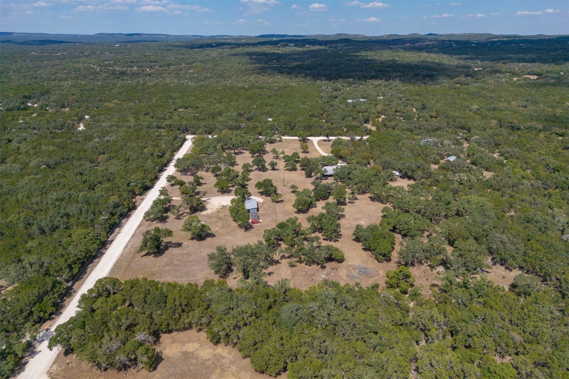 1301 Sandy Point Road Wimberley, TX 78676 - Photo 14 of 25 a view of a lake in a field