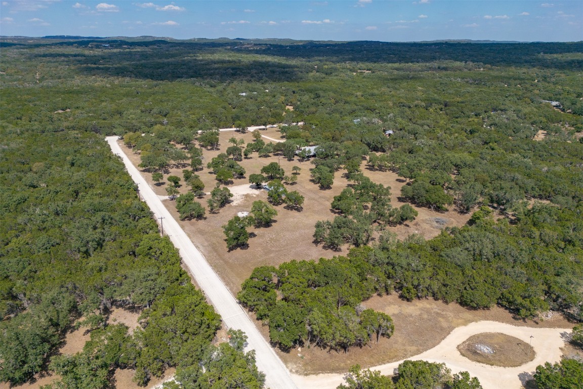 1301 Sandy Point Road Wimberley, TX 78676 - Photo 15 of 25 a view of a lake from a yard