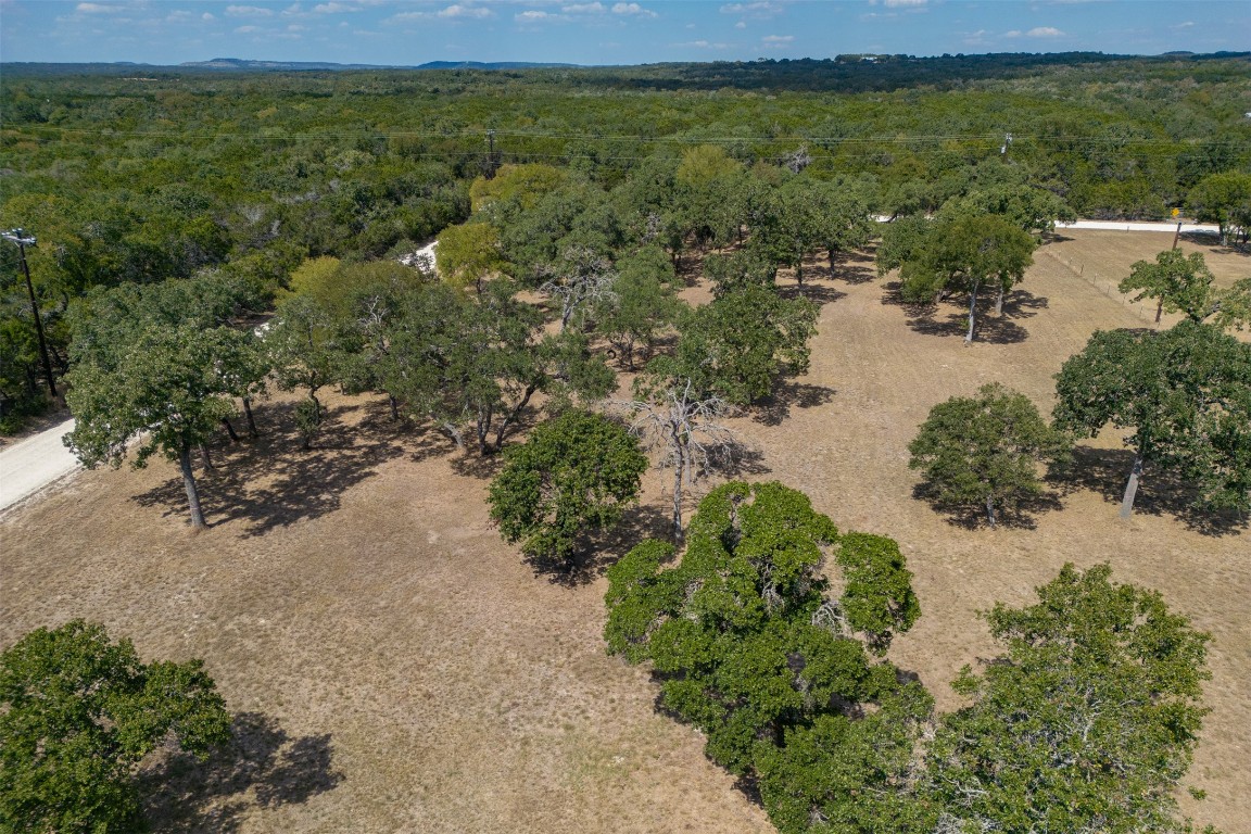 1301 Sandy Point Road Wimberley, TX 78676 - Photo 20 of 25 a view of a lake with beach and outdoor space