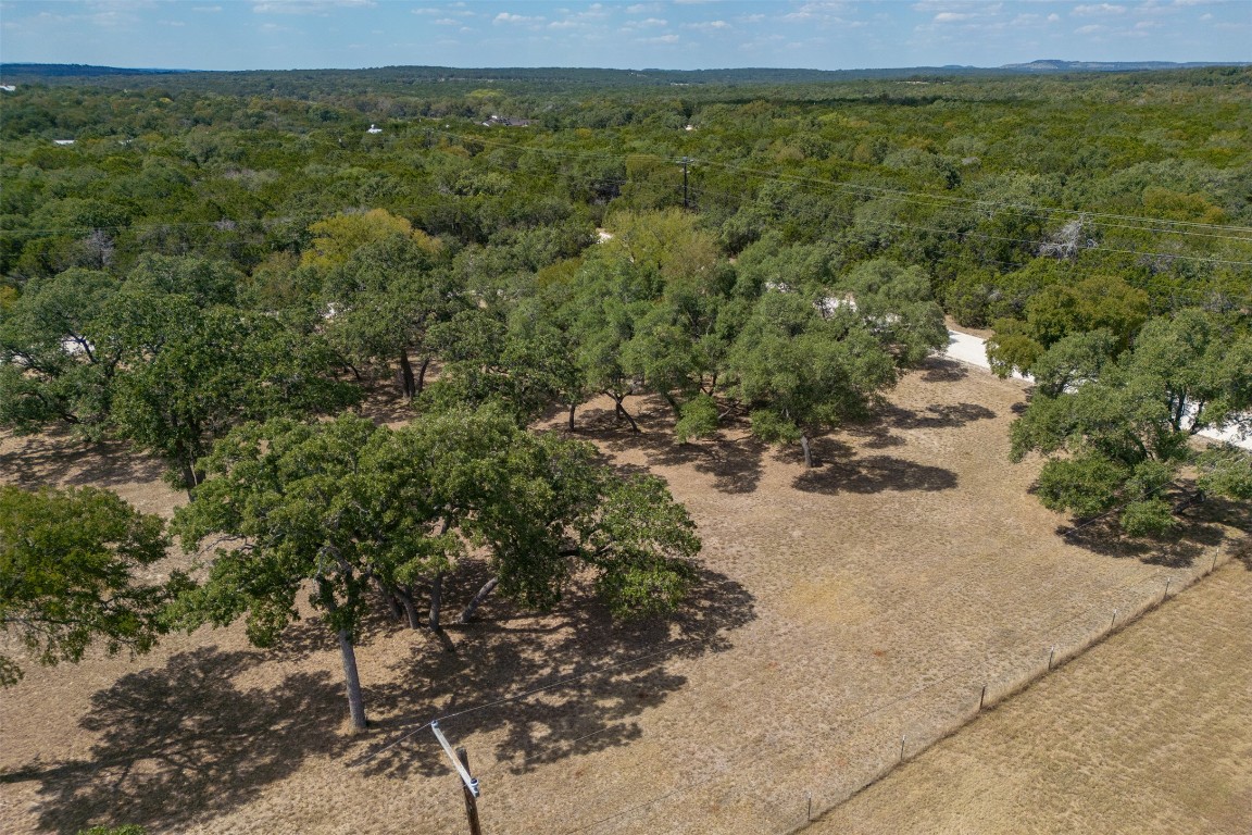 1301 Sandy Point Road Wimberley, TX 78676 - Photo 3 of 25 a view of a yard with an outdoor space