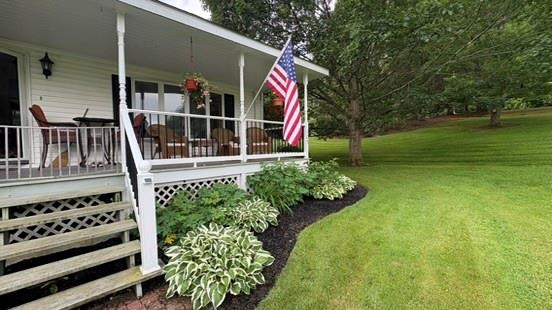 105 White Sulphur Road Swan Lake, NY 12783 - Photo 15 of 42 a front view of a house with garden