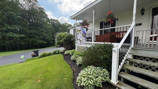 105 White Sulphur Road Swan Lake, NY 12783 - Photo 18 of 42 a view of a house with backyard and sitting area