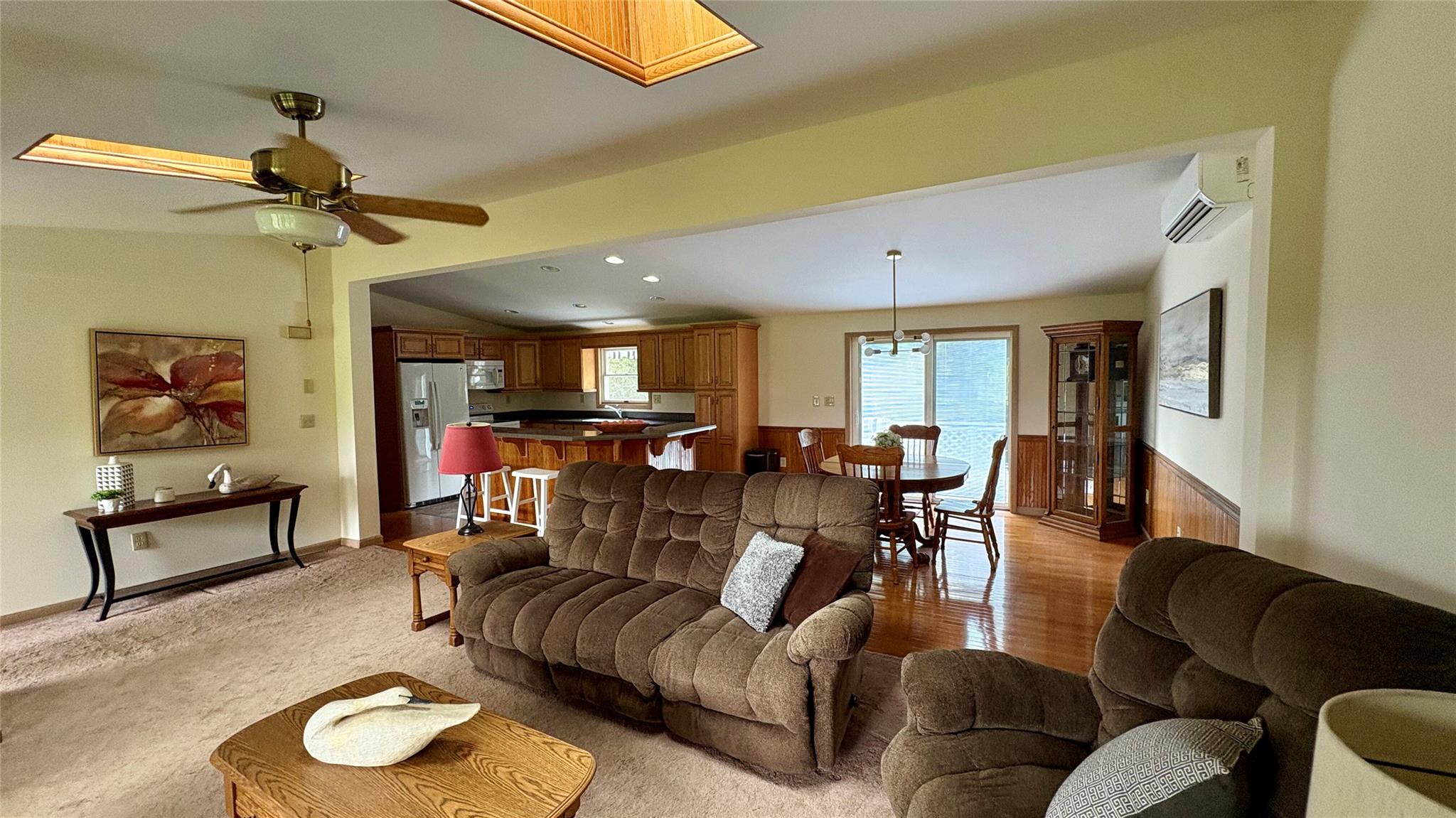 105 White Sulphur Road Swan Lake, NY 12783 - Photo 24 of 42 a living room with furniture and a chandelier