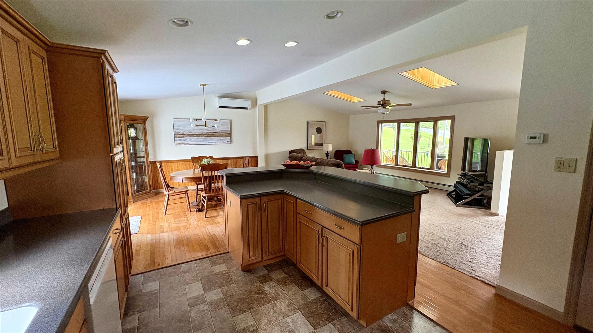 105 White Sulphur Road Swan Lake, NY 12783 - Photo 41 of 42 a kitchen with stainless steel appliances granite countertop a sink a stove and a refrigerator
