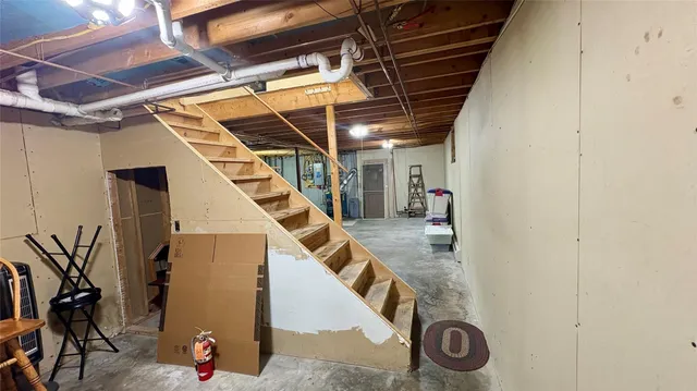 a kitchen with stainless steel appliances a refrigerator sink and cabinets