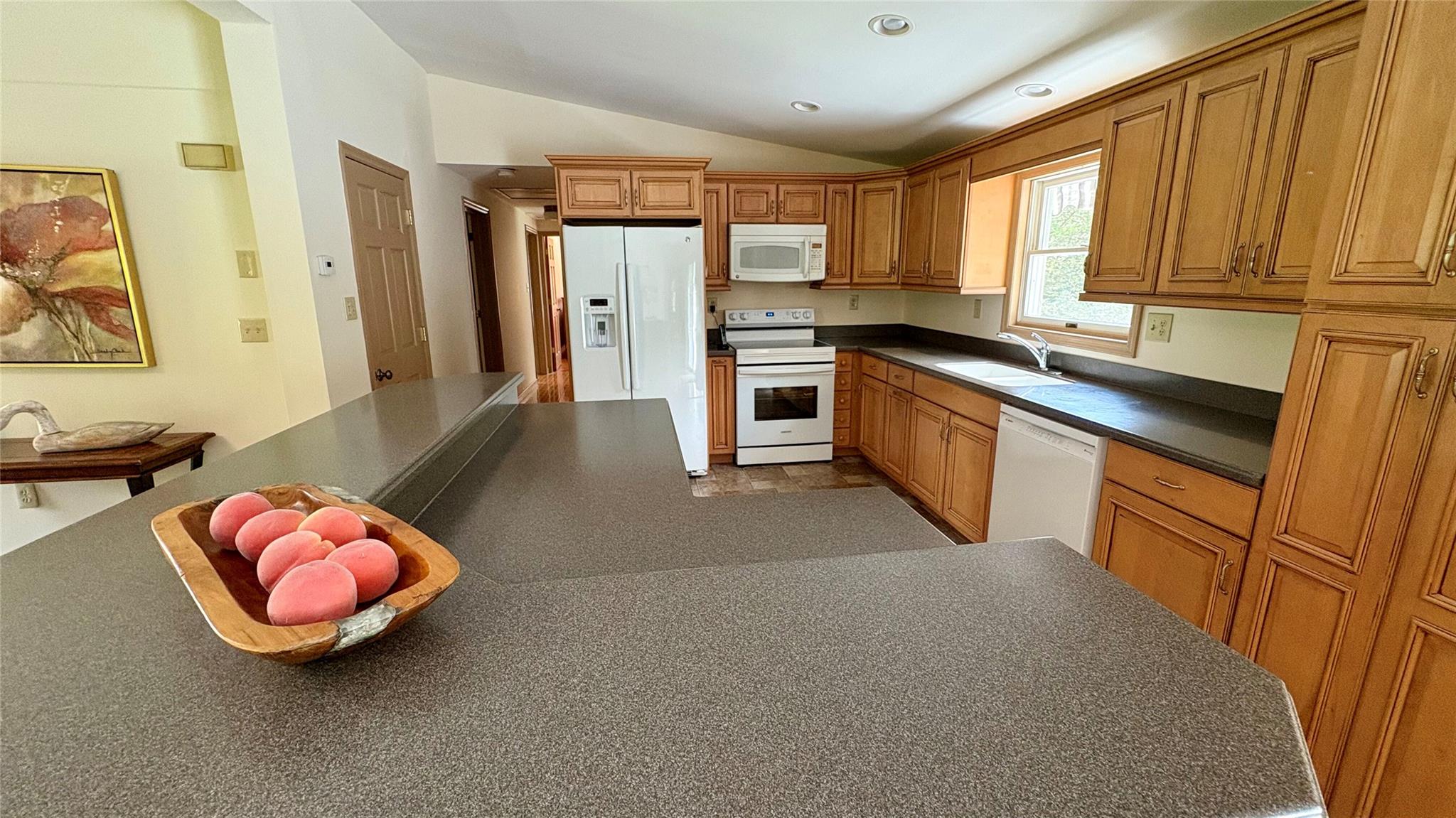 105 White Sulphur Road Swan Lake, NY 12783 - Photo 40 of 42 a kitchen with stainless steel appliances a refrigerator sink and cabinets