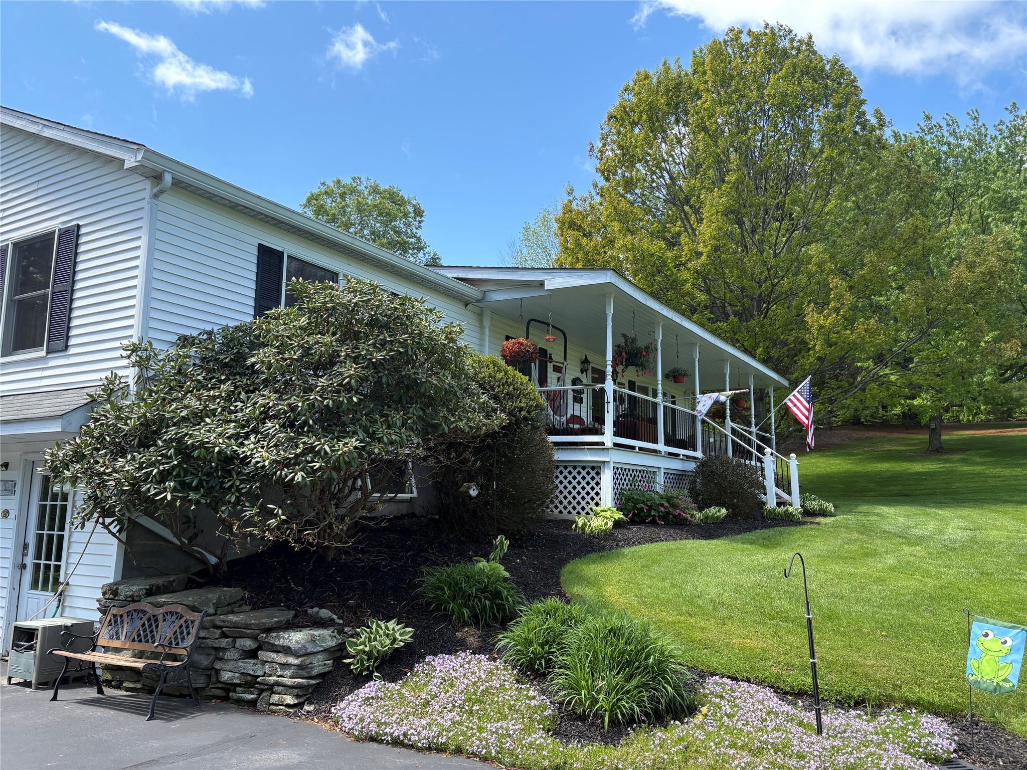 105 White Sulphur Road Swan Lake, NY 12783 - Photo 5 of 42 a house view with a garden space