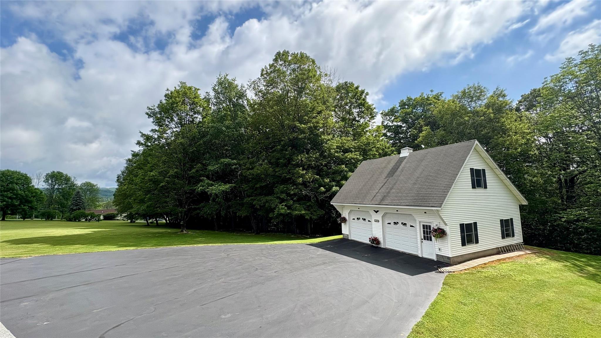 105 White Sulphur Road Swan Lake, NY 12783 - Photo 7 of 42 a view of a house with a yard and large trees