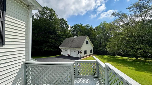 a view of a house with pool and yard