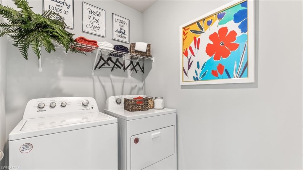 17613 Shade Tree Loop Punta Gorda, FL 33982 - Photo 12 of 27 a utility room with dryer and washer