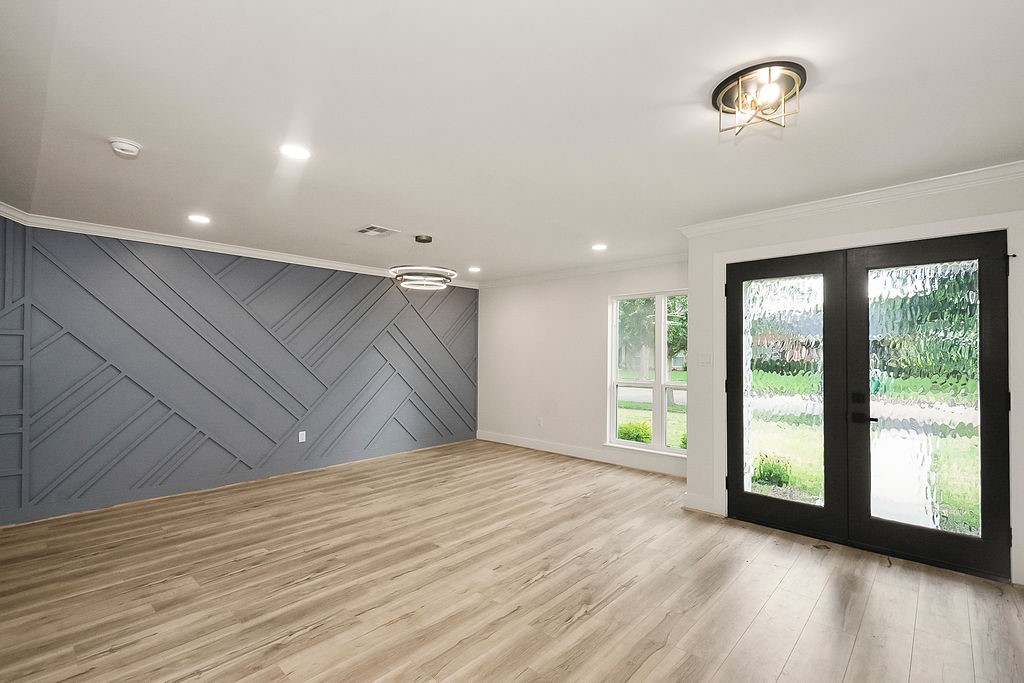 6106 Rutherglenn Drive Houston, TX 77096 - Photo 7 of 41 Expansive living area filled with natural light and views of the backyard through oversized glass doors.