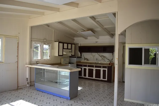 a kitchen with stainless steel appliances granite countertop a stove and a sink