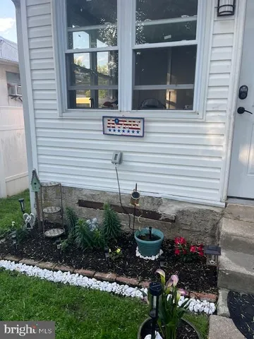 a view of a house with a flower garden